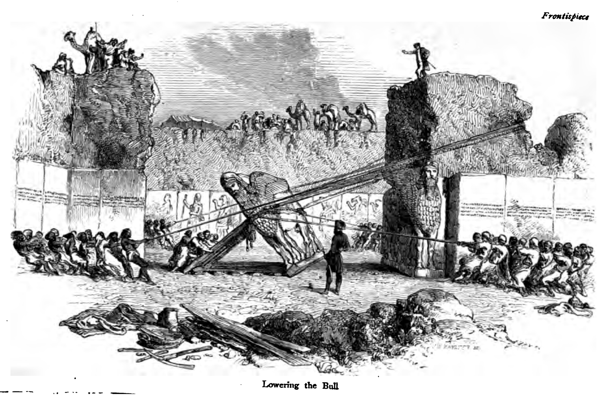 A black and white illustration of an archeological excavation at Nineveh in the 1850s. Many workers are lowering a bull sculpture on ropes.