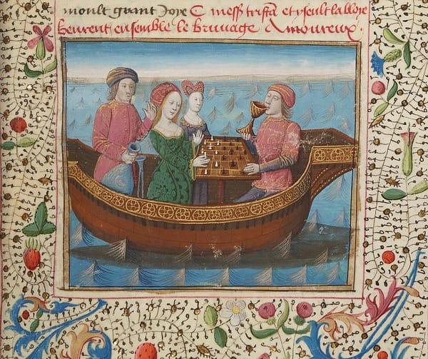 Illuminated manuscript illustration of Tristan and Isolde playing chess on a boat. Tristan is drinking from a goblet. The painting is surrounded by delicately drawn flowering vines.